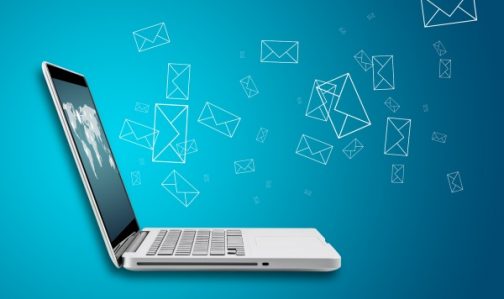 Computer laptop send email concept on blue background