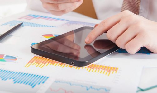 Businessman using a credit card and digital tablet for buying on-line